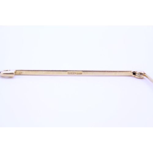 98 - An 18ct Gold tie pin. Weighing: approx 3.5 grams.