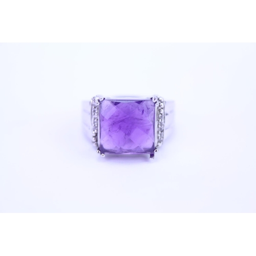 150 - A ladies 925 Silver ring set with an amethyst coloured stone.