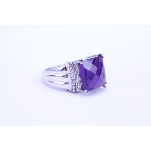 150 - A ladies 925 Silver ring set with an amethyst coloured stone.