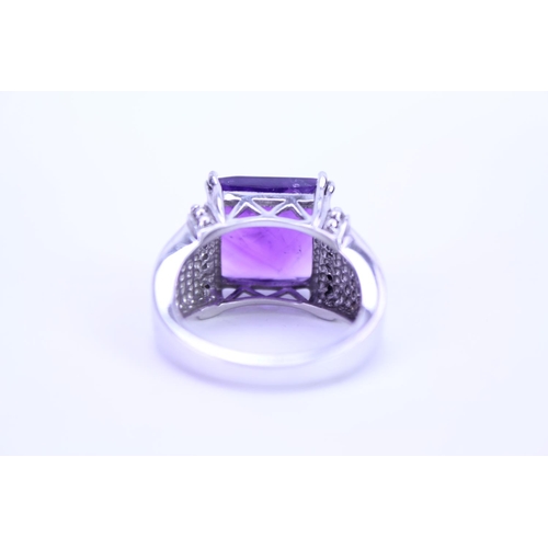 150 - A ladies 925 Silver ring set with an amethyst coloured stone.