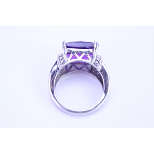 150 - A ladies 925 Silver ring set with an amethyst coloured stone.