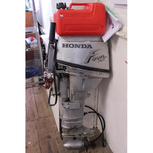 573 - A 1990s Honda 9.9 Four Stroke Outboard Motor with Separate Fuel Tank & Owners Manual. (Not Tested).