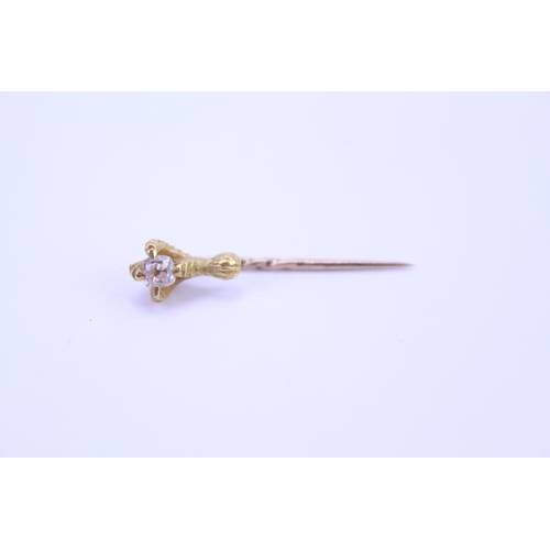 145 - An 18ct Gold Eagle Claw stick pin set with an old cut Diamond, approximately 0.15 pts. Weight approx... 