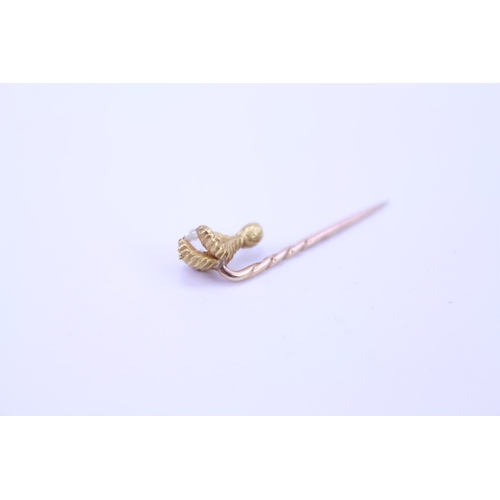 145 - An 18ct Gold Eagle Claw stick pin set with an old cut Diamond, approximately 0.15 pts. Weight approx... 