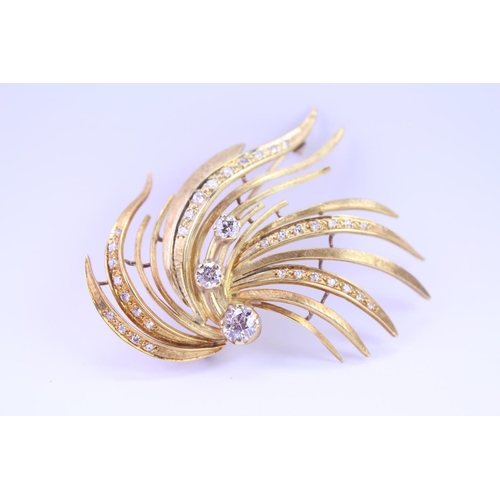 147 - An 18ct Gold Diamond spray brooch, set with three old cut Diamonds, along with 34 small Diamonds. Th... 