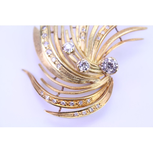 147 - An 18ct Gold Diamond spray brooch, set with three old cut Diamonds, along with 34 small Diamonds. Th... 