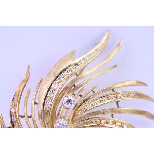 147 - An 18ct Gold Diamond spray brooch, set with three old cut Diamonds, along with 34 small Diamonds. Th... 