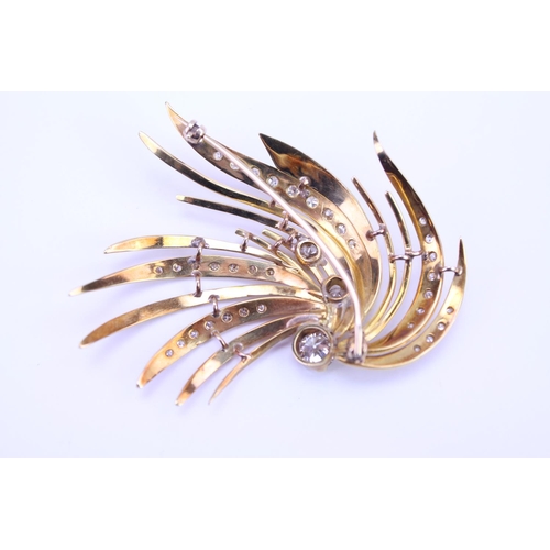 147 - An 18ct Gold Diamond spray brooch, set with three old cut Diamonds, along with 34 small Diamonds. Th... 