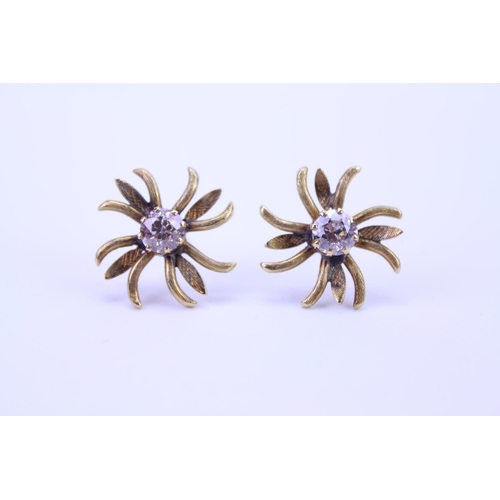 148 - A Pair of Gold French design floral Diamond set earrings. Diamond size approximately 0.25. Total gro... 