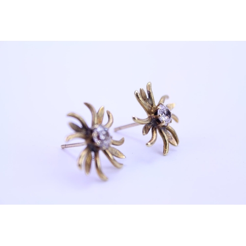 148 - A Pair of Gold French design floral Diamond set earrings. Diamond size approximately 0.25. Total gro... 