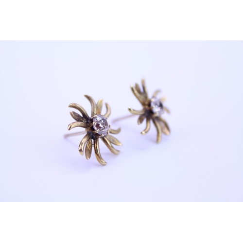 148 - A Pair of Gold French design floral Diamond set earrings. Diamond size approximately 0.25. Total gro... 