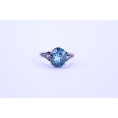 141 - A 9ct and Platinum set ring set with a blue stone. Ring size approximately O. Total weight approxima... 