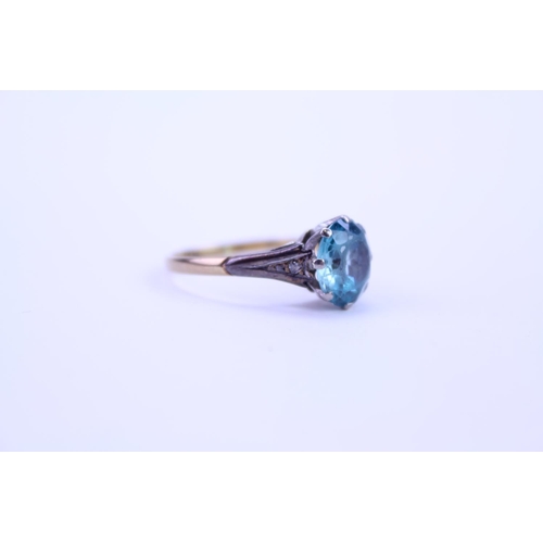 141 - A 9ct and Platinum set ring set with a blue stone. Ring size approximately O. Total weight approxima... 