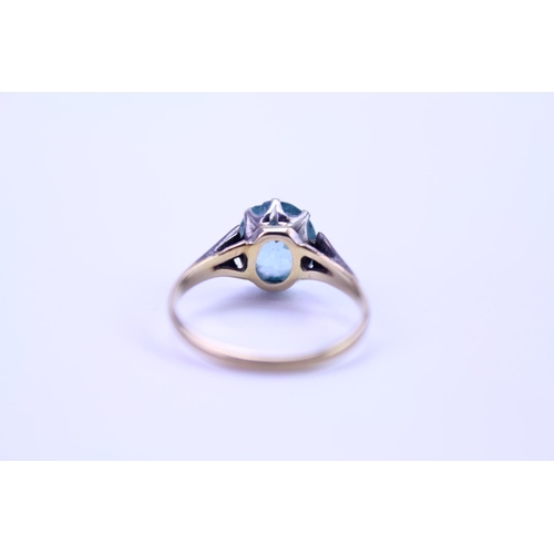 141 - A 9ct and Platinum set ring set with a blue stone. Ring size approximately O. Total weight approxima... 