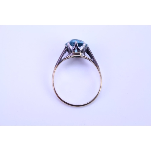 141 - A 9ct and Platinum set ring set with a blue stone. Ring size approximately O. Total weight approxima... 