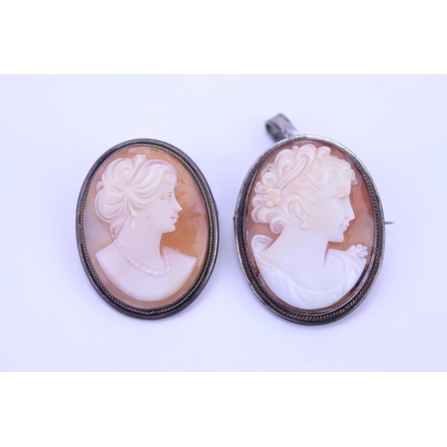 142 - A Pair of White Metal Cameo Brooches with pendant attachments. Size approximately: 3cm x 2.3cm.