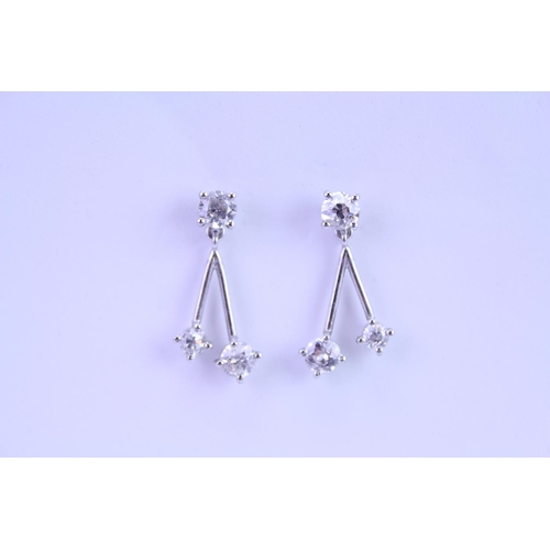 139 - A Pair of Diamond Drop Earrings set is 18ct white Gold. 0.2ct approximately is the largest diamond.