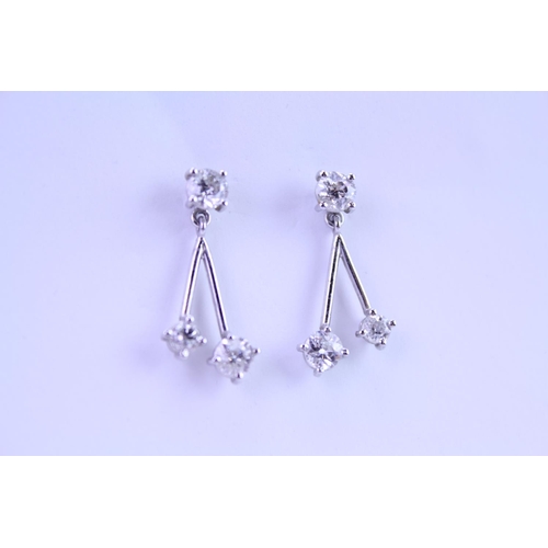 139 - A Pair of Diamond Drop Earrings set is 18ct white Gold. 0.2ct approximately is the largest diamond.