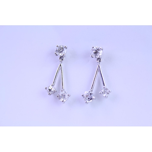 139 - A Pair of Diamond Drop Earrings set is 18ct white Gold. 0.2ct approximately is the largest diamond.