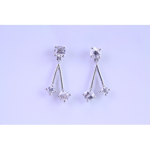 139 - A Pair of Diamond Drop Earrings set is 18ct white Gold. 0.2ct approximately is the largest diamond.