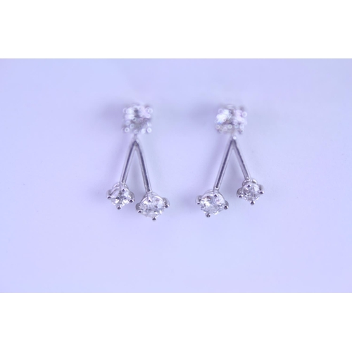 139 - A Pair of Diamond Drop Earrings set is 18ct white Gold. 0.2ct approximately is the largest diamond.