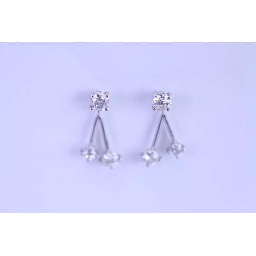 139 - A Pair of Diamond Drop Earrings set is 18ct white Gold. 0.2ct approximately is the largest diamond.