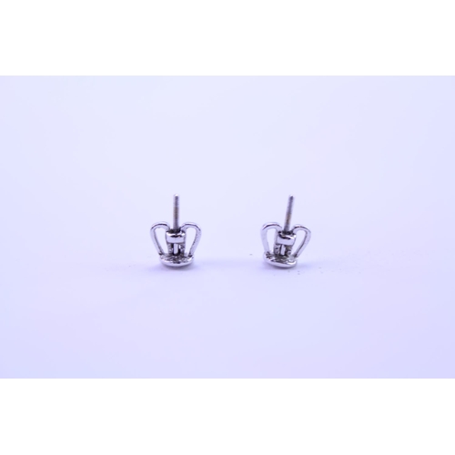 139 - A Pair of Diamond Drop Earrings set is 18ct white Gold. 0.2ct approximately is the largest diamond.