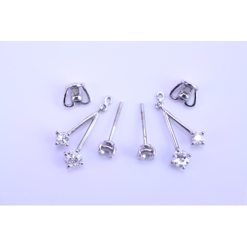 139 - A Pair of Diamond Drop Earrings set is 18ct white Gold. 0.2ct approximately is the largest diamond.