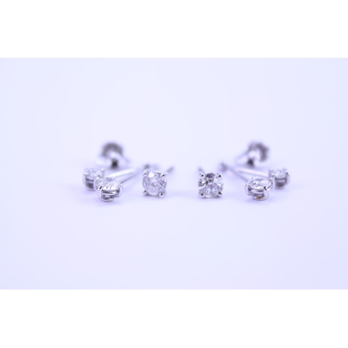 139 - A Pair of Diamond Drop Earrings set is 18ct white Gold. 0.2ct approximately is the largest diamond.