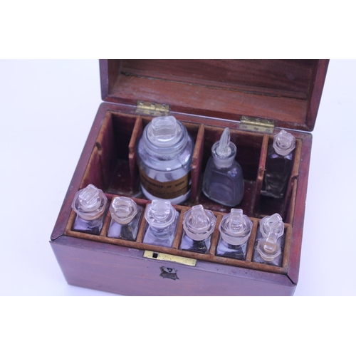 563 - A Victorian Mahogany Cased Pharmaceutical Box with Red Velvet interior, Glass Bottles & Stoppers, Dr... 