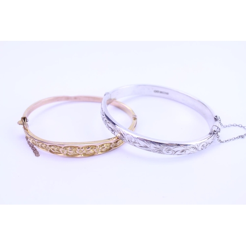 169 - A Ladies 9ct Gold Bangle. Weighing: 6 Grams. Along with a Silver Bangle.