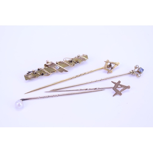 157 - A collection of 3 x 9ct Gold stick pins, a 15ct marked stick pin with a blue stone along with a 9ct ... 