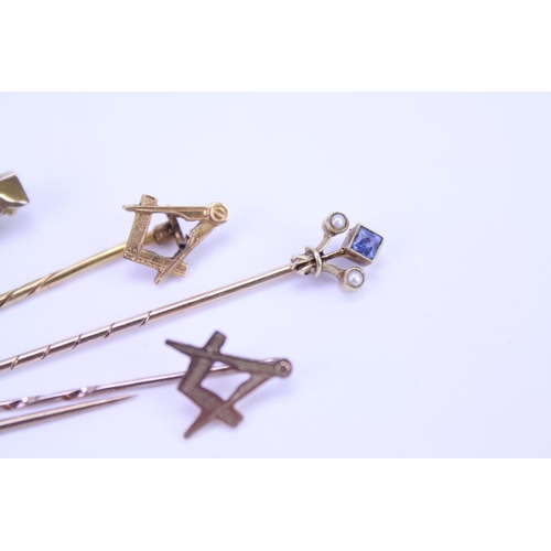 157 - A collection of 3 x 9ct Gold stick pins, a 15ct marked stick pin with a blue stone along with a 9ct ... 