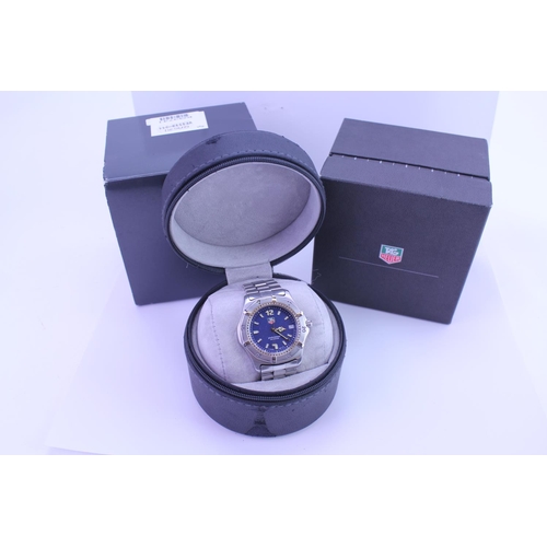 212 - A Tag Heuer 2000 Series Wristwatch with a Blue Face, one spare link, Original Box & Papers.