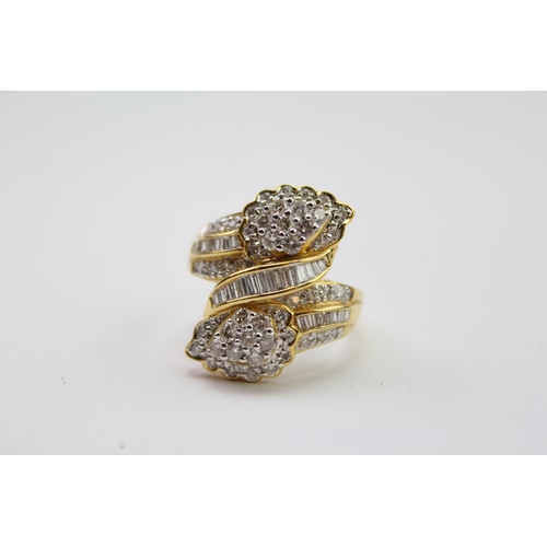 184 - A ladies baguette & round diamond twin headed ring, mounted in a 18 carat Gold setting. Size N. Weig... 