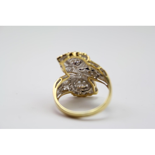 184 - A ladies baguette & round diamond twin headed ring, mounted in a 18 carat Gold setting. Size N. Weig... 