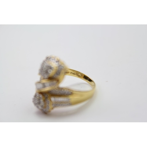 184 - A ladies baguette & round diamond twin headed ring, mounted in a 18 carat Gold setting. Size N. Weig... 