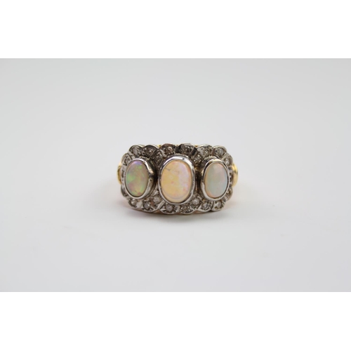 185 - A ladies diamond and 3 stone opal ring, in 18 carat gold. 22 diamonds in total. Size O. Weight appro... 