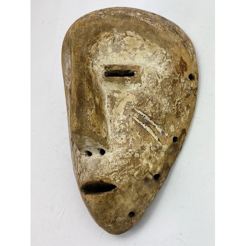 567A - A carved Tribal mask, for ceremonial use.