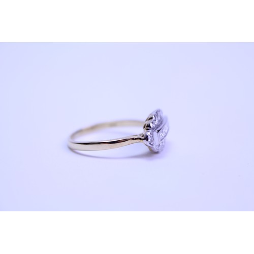 104 - A art deco 18ct gold ring, set with 18 small diamonds.