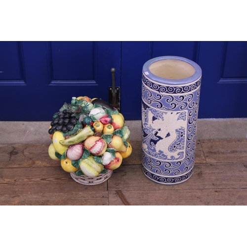 782 - A Chinese Pottery Blue & Cream Umbrella Stand along with an Italian Majolica Bowl of Fruit.