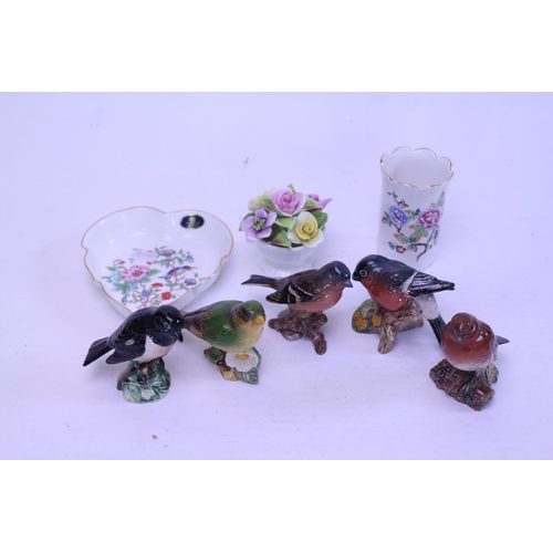 808 - A collection of China to include Beswick Birds to include a Robin, Green Finch, Bull Finch, Stone Ch... 