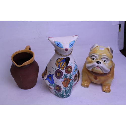 852 - A Verwood jug, a Pottery study of a dog and a Cypriot study of a cat.