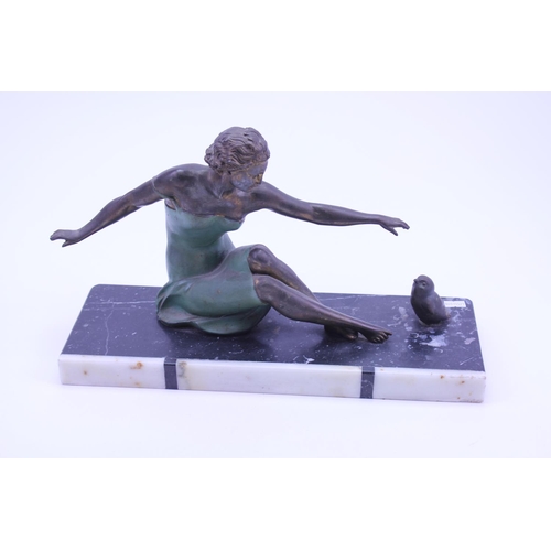 406 - A French Spelter Study an Art Deco Young Lady feeding a Bird on a Banded Marble Base. Measuring 40cm... 