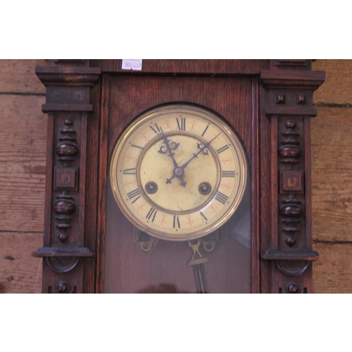 284 - A Late 19th Century Viennese Carved Fronted Wall Clock with Celluloid Dial.