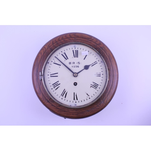 285 - A British Railways B.R.(S) Oak Cased Clock with Brass mechanism, painted dial No: 11236. Measuring: ... 