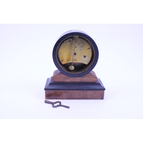 287 - A Victorian Ebony & Mahogany Circular enamel face Drawing Room Clock fitted with a French Movement b... 