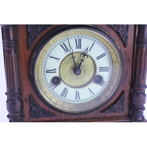 288 - A German Made Bracket Clock in a Black Forest design Case, Chaptering, Black Numerals & Twin Winder.... 