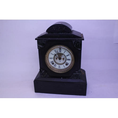 293 - A late 19th Century marble and slate cased clock with visible escapement.