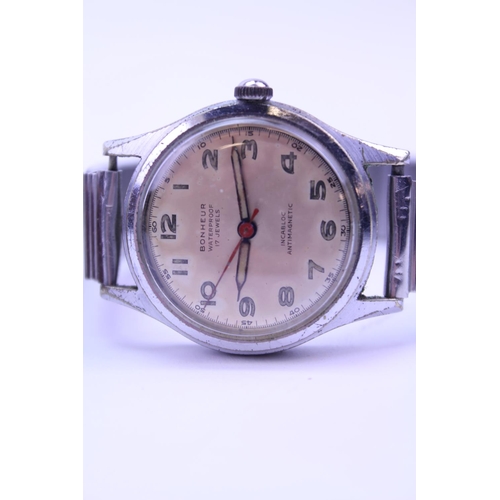 279 - A collection of three watches to include a Chrysler Gentleman's Steel Cased Watch, a Bonheur Steel C... 